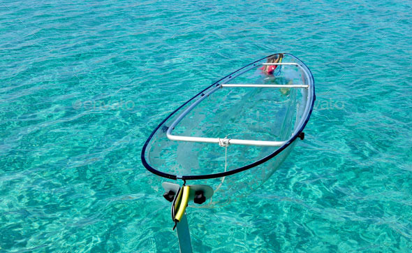 Sea surface turquoise blue color background, some reflections. C Turquoise blue color crystal clear sea water background, some reflections. Calm surface with small ripples, Summer vacation at tropical paradise.